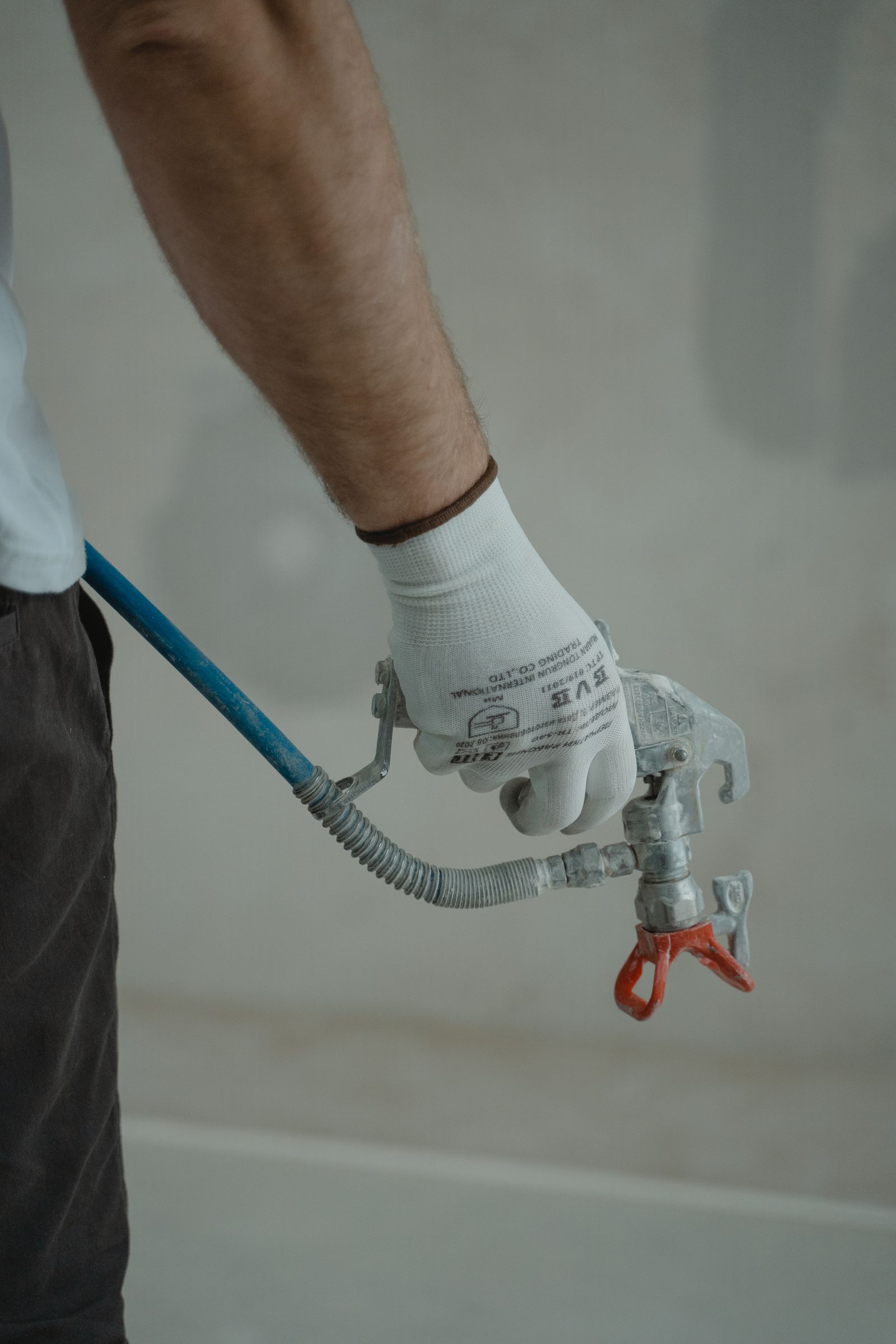Plumber tightening a valve on a copper line